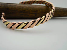 Load image into Gallery viewer, Hand forged twisted copper and brass wire cuff bracelet